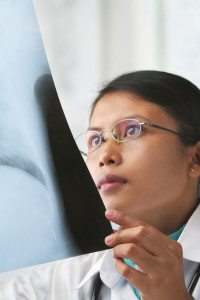 Female Doctor Examines X-Ray